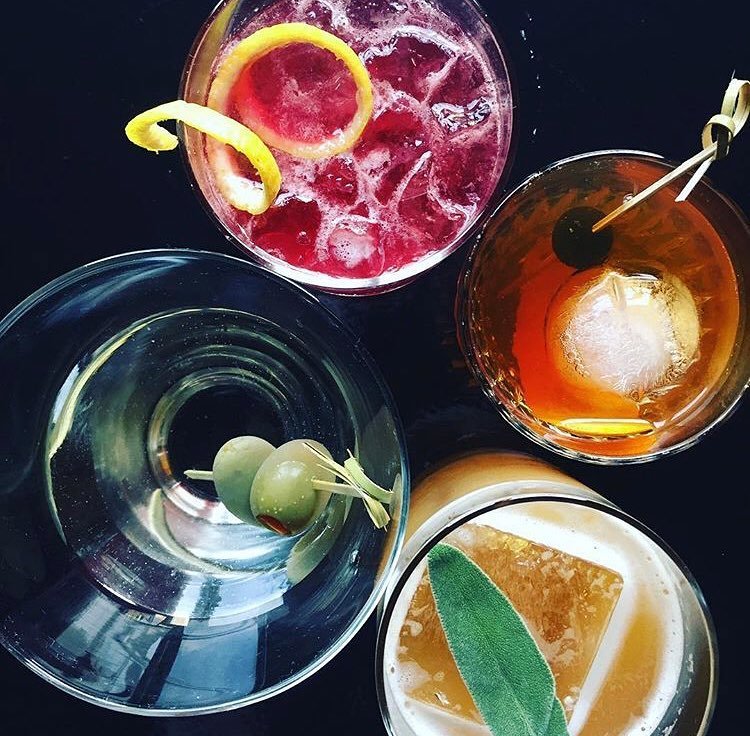 over view of various prepared cocktails of different ingredients with garnish