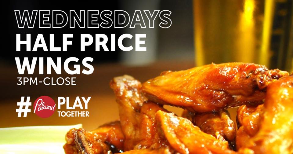 company advertisement featuring white copy and chicken wing closeup on the right side in front of pint of beer