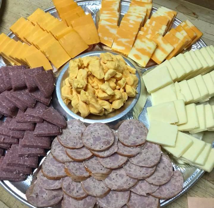 circular charcuterie board with meat and cheese