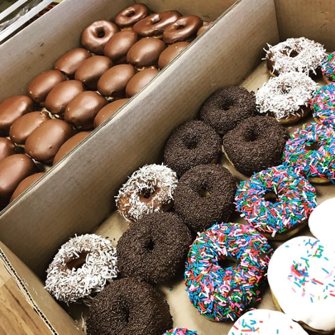 box of dozens of different donuts in separated boxes