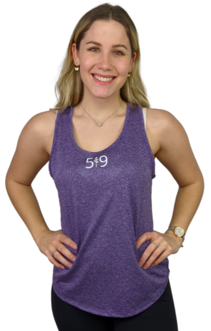 woman modelling a purple tank top with branding in white on the front breast against a white background