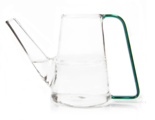 mid sized glass watering can with a thin green handle filled halfway with water