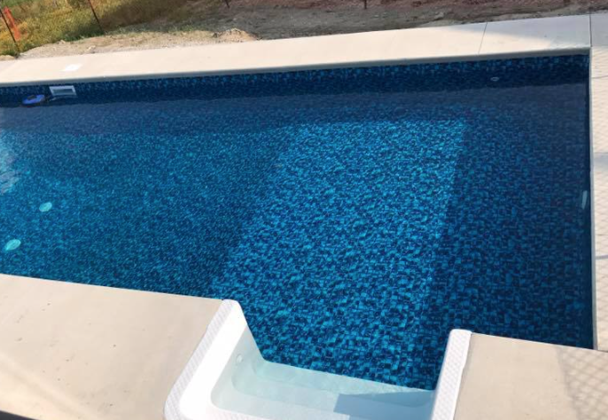 large rectangular pool that has just been cleaned