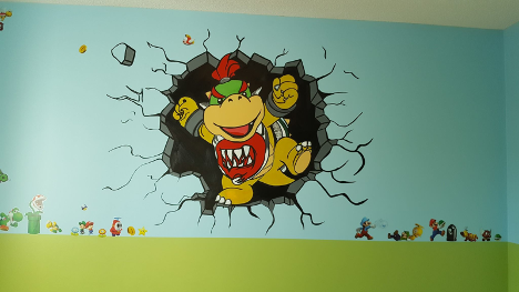 childs room with painted wall featuring baby bowser coming out of a hole