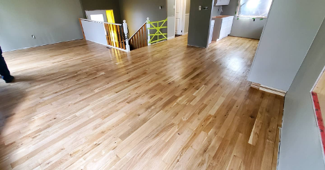 light brown hardwood floor panels in a house being renovated