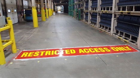 warehouse with restricted access painting in yellow and red on the floor