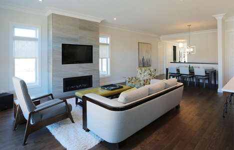 living room with contemporary styling with yellow coffee table, grey white and black accents throughout