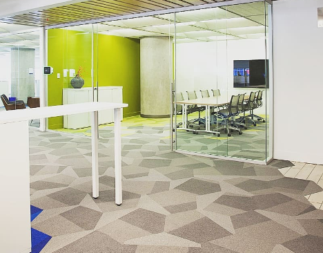office space with large board room with a lime green wall and bright coloured accents