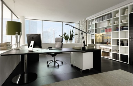 Large office desk with various organizers around the room with different things on them