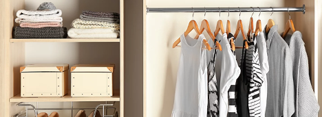 closet organizer with white and black clothes hanging to the right