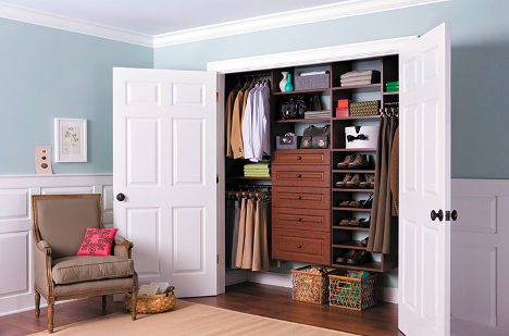 Organized closet with custom shelving baskets and organizers