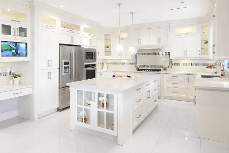 all white kitchen with long island with cupboards and drawers