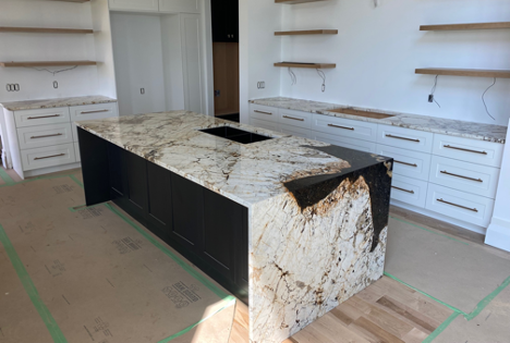 dark and light countertop freshly installed in new build home