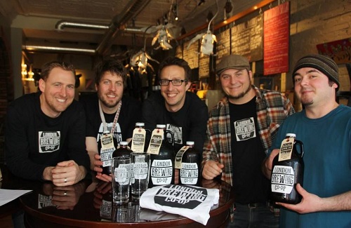 London Brewing Co-op team holding growlers and smiling