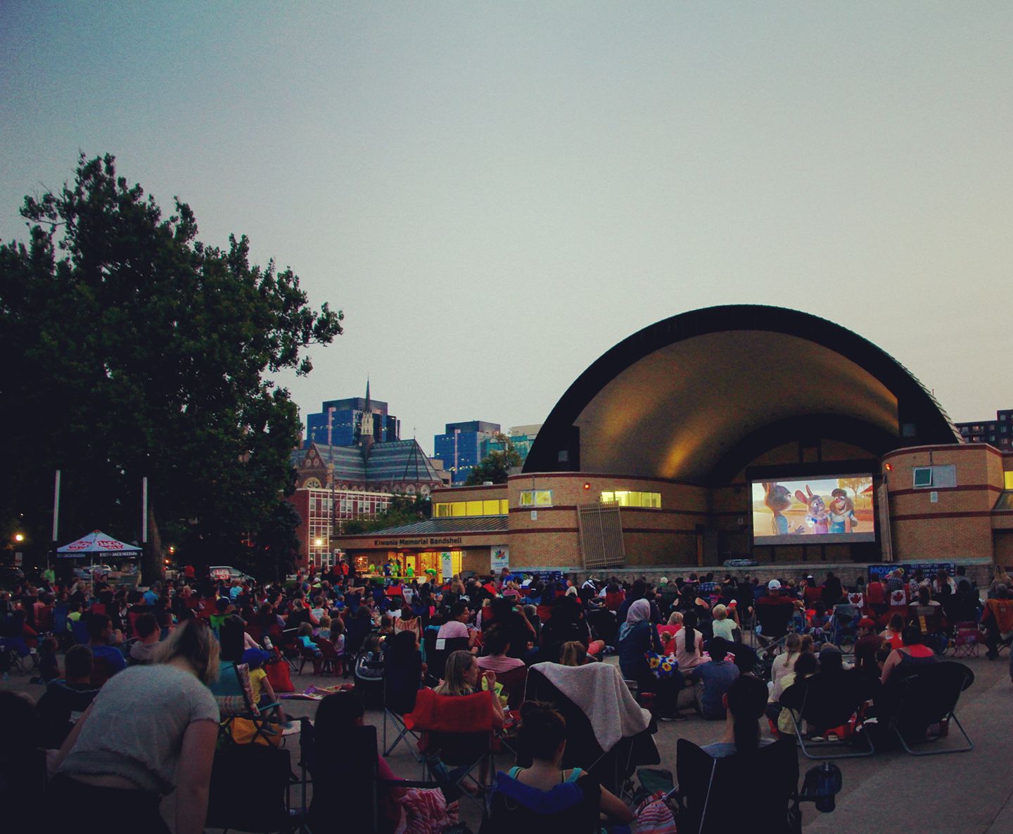 victoria park bandshell with full audience at dusk waiting for movie night