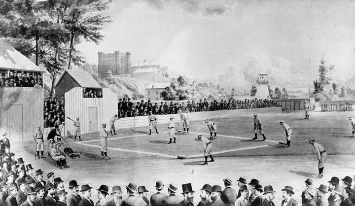 historic black and white photo of men playing baseball with crowd from newspaper