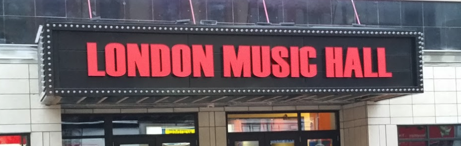 music hall entrance sign with red letters on white background