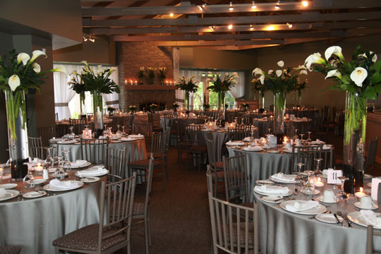 Golf Course's Banquet Hall with set tables and floral arrangements
