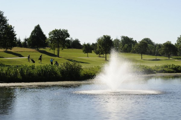 Golf course with large fountain feature and shot of fairway in background