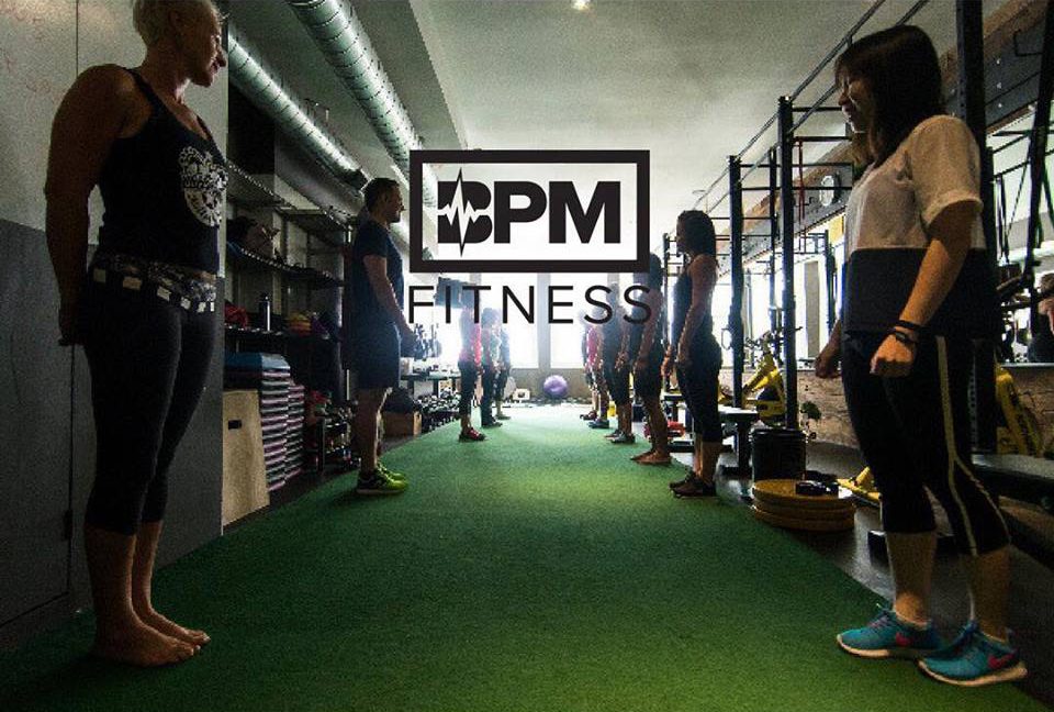 fitness advertisement with bpm fitness copy with group working out in a gym in behind