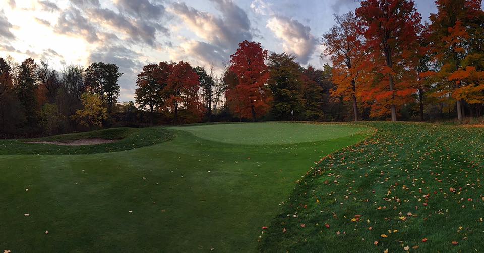 Golf Club outdoor at sunset with fall leaves leading to the green