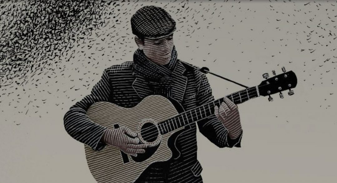 man playing guitar with black spec details in top left corner