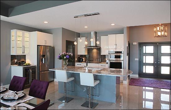 interior of modern kitchen island with dark purple accents and stainless steel