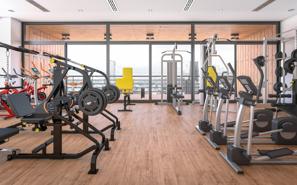 gym and fitness centre with equipment and many large windows