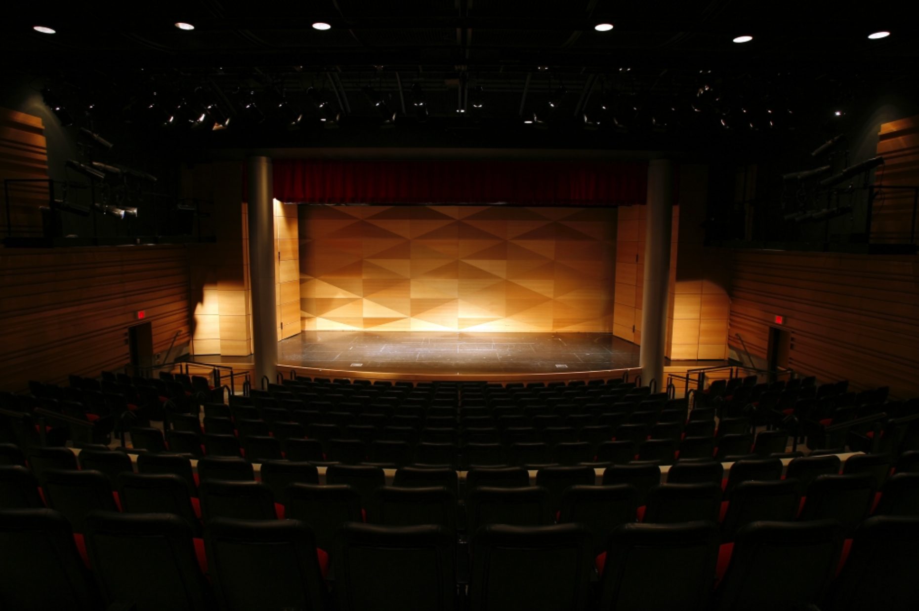 performance hall stage view from seats with lit stage